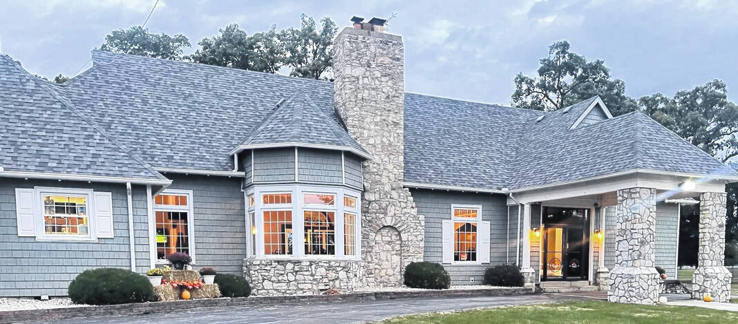 Front of the clubhouse at The Greens with stone chimney